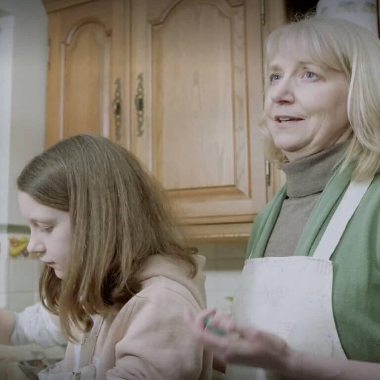 Woman and her daughter cooking together