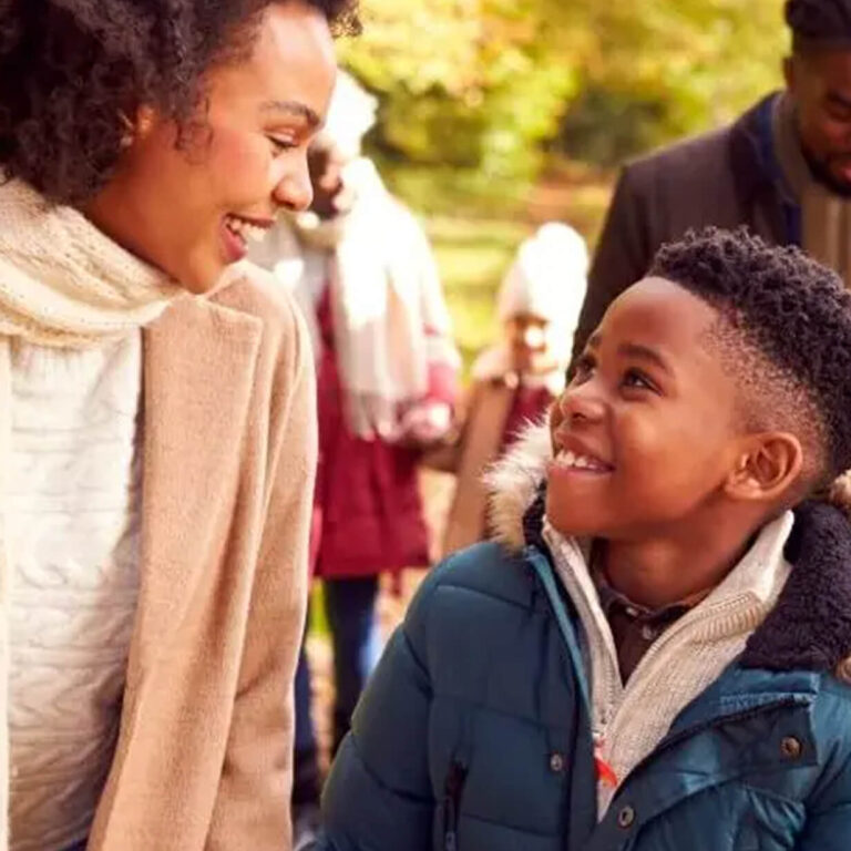 Image of a mother and child, happily walking