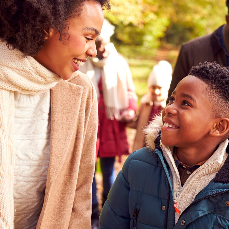Image of a mother and child, happily walking