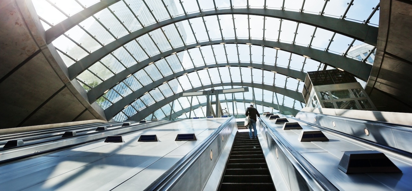 Person on an escalator in Canary Wharf station